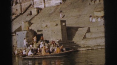 1962: a laundry scene is seen people are washing clothes beside a water body