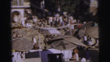 1962: large, white buildings,one showing an arched entry, back a space