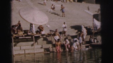 1962: people are seen bathing in some ritual or so and a boat seem passing by