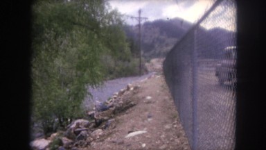 1962: parked along fenced bordering stream COLORADO
