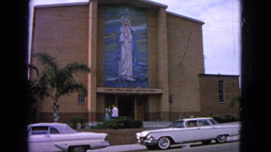 1963: couple waiting outside a beautiful church. BARRINGTON, ILLINOIS