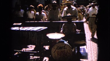 1963: a band is seen playing instruments in the open for people BARRINGTON,