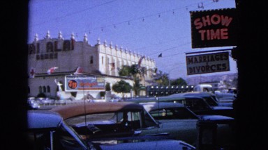 1963: this street crossing while busy, shows the jai alai sports center in town.