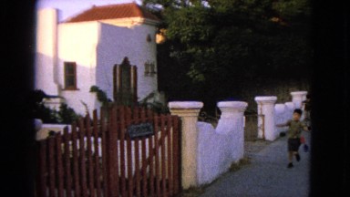 1963: children running free past the garden gate. BARRINGTON, ILLINOIS