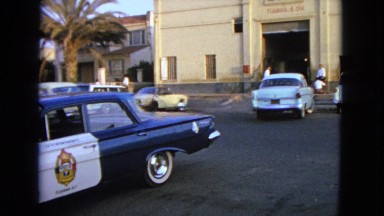 1963: a car is seen reversing and hurrying to the street BARRINGTON, ILLINOIS