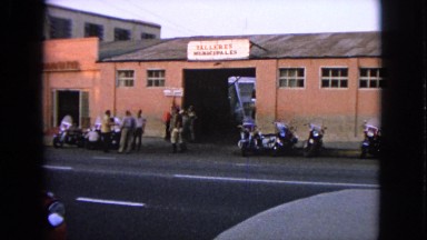 1963: cars are seen passing by a building BARRINGTON, ILLINOIS