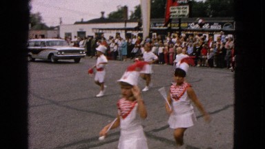1963: the video shows little girls performing an act like a parade
