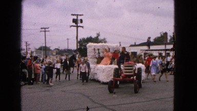 1963: 4-j parade float being pulled by a tractor. BARRINGTON, ILLINOIS