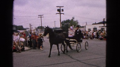 1963: horse and buggies parade through the cities downtown streets BARRINGTON,
