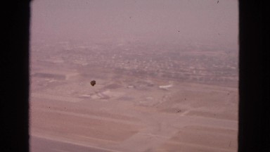 1963: video of aerial view from an airplane window of ocean and land BARRINGTON,