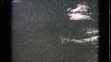 1963: the scene shows an aerial view of beautiful mountains and high grasslands