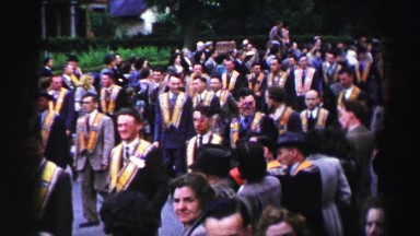 1952: parade of men adorned with yellow sashes ENGLAND