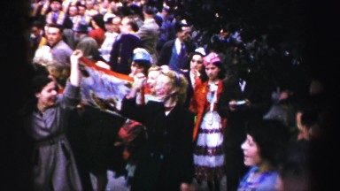 1952: a parade scene is seen with women holding a flag ENGLAND