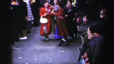 1952: merriment in the crowded streets ENGLAND