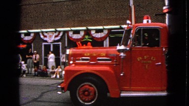 1963: Fire Brigade Marches in Parade Through Barrington, Illinois