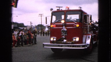 1963: The Red Fire Engine Truck Passing Through the Crowd in Barrington, Illinois