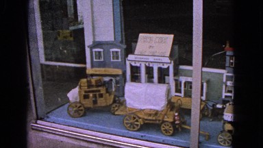 1963: video of store window display featuring buggies and vintage store fronts