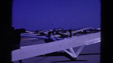 1964: man carrying parachute leaves airplane ELMIRA, NEW YORK