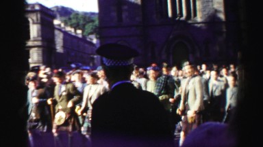 1952: People Passing By A Parade In England