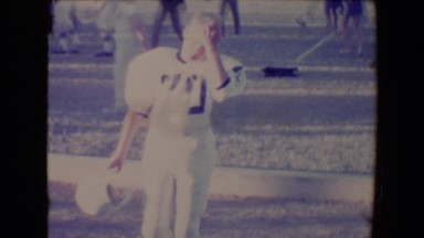 1967: Taking a break from playing football.TUCSON, ARIZONA