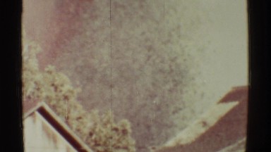 1971: volcanic eruption and ashes falling behind house as a result of