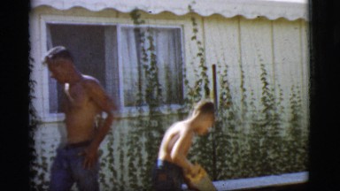 1968: A Child Sawing Wood in Cottonwood, Arizona