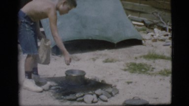 1968: a topless kid is seen pouring in a pot COTTONWOOD, ARIZONA
