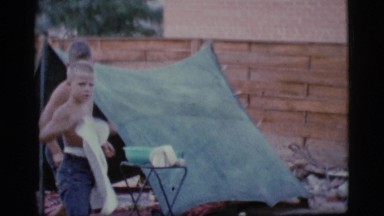 1968: little boys are washing dishes outdoors COTTONWOOD, ARIZONA