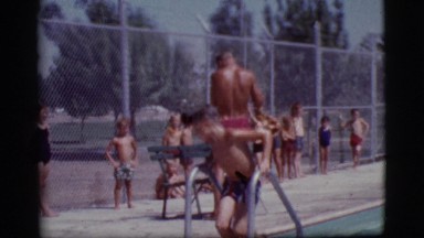 1968: kids take turns practicing their newly learned water skills. COTTONWOOD,