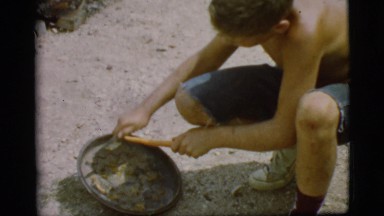 1968: a boy cleaning carrot COTTONWOOD, ARIZONA