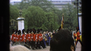 1969: military parade with a standard-bearer before a small crowd IRELAND
