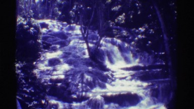 1971: relaxing in nature watching a waterfall in the woods HAWAII