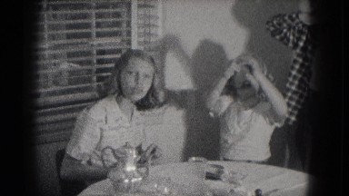 1953: siblings are seen on a table posing MILWAUKEE, WISCONSIN