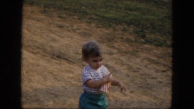 1964: Little Girl Walks to Her Stroller in Albany, New York