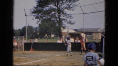 1964: boys intense little league baseball game at the town park ALBANY, NEW YORK