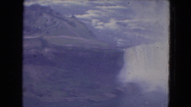 1964: view of niagara falls from an airplane with rocks and mist