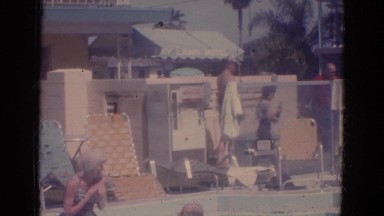 1966: a kid is seen diving in water in a outdoor pool FLORIDA