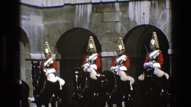 1969: people in uniforms on horses sit while horses buck their heads ENGLAND