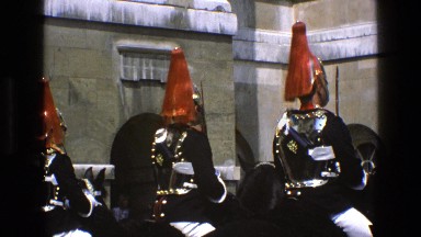 1969: a group of soldiers on horseback, dressing colorful hats