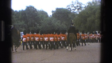 1969: exterior view, likely of uk, shows royal officers of the queen moving in