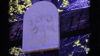 1965: religious stone and writing underneath titled jesus meets his mother