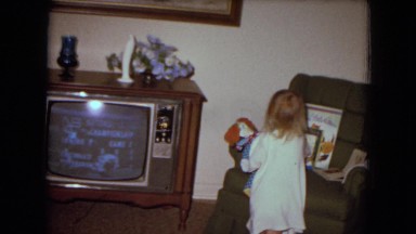1970: A Young Girl Playing With Her Doll in White Sands, Florida