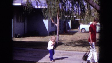 1970: a daughter is seen following her mother WHITE SANDS, FLORIDA