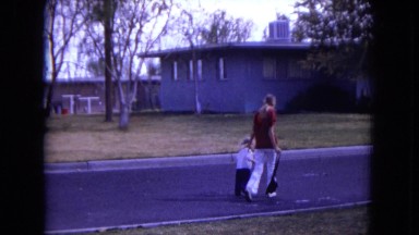 1970: mother and tougher are walking WHITE SANDS, FLORIDA