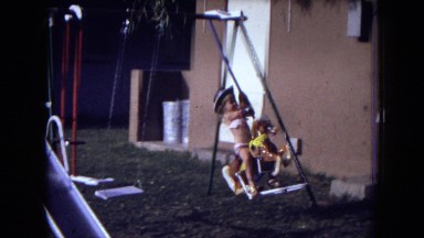 1973: Children Playing on Swing in New Mexico Park