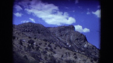 1973: a mountain area is seen traveling by road NEW MEXICO
