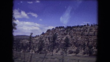 1973: a rocky mountain is seen from a car NEW MEXICO