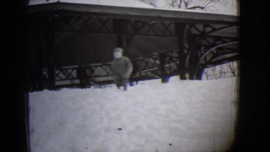 1944: a child is seen walking in a snowy area MICHIGAN