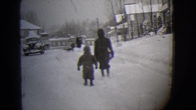 1944: kids walking in the snow MICHIGAN