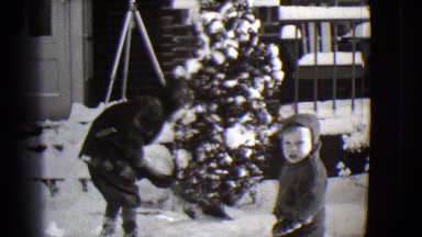 1944: two children are in front of a house on a really snowy day MICHIGAN